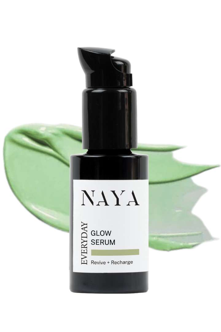 Naya Everyday Glow Serum bottle with green leaf background