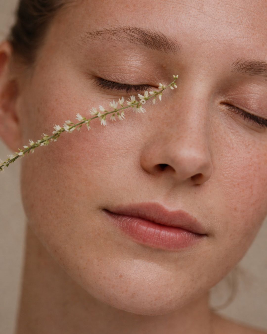 Editorial NAYA eye care portrait with closed eyes and flower petals