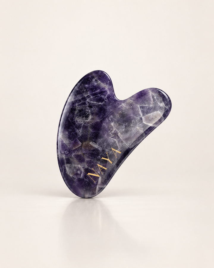 NAYA amethyst gua sha facial massage tool.
