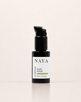 NAYA Everyday Glow Serum in a black pump bottle with a white label, set against a clean off-white background.