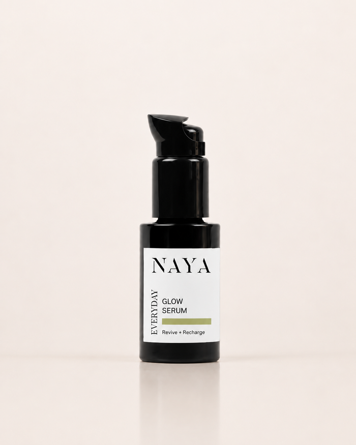 NAYA Everyday Glow Serum in a black pump bottle with a white label, set against a clean off-white background.