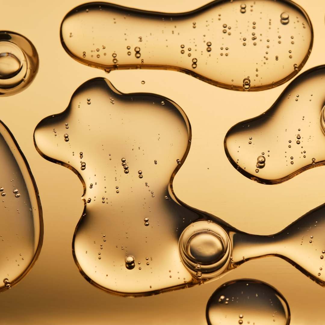 Close-up of gold liquid with bubbles