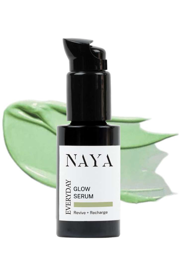 Naya Everyday Glow Serum bottle with green leaf background
